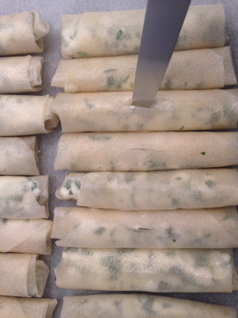 Make a cut of 1 cm in each for the vapour to escape otherwise the cheese will go out from the rolls. Bake in a preheated oven 180C for around 20 mins. Turn around the tray at half time.