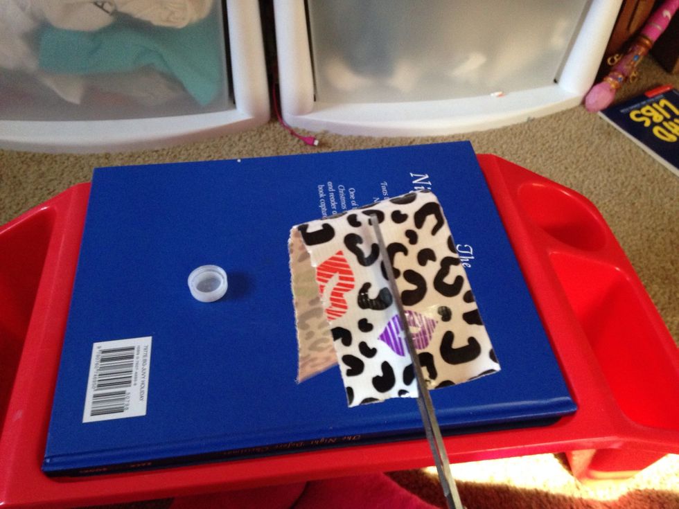 Make a cut to split the tape in half. After you make that cut, you can just rip it the rest of the way.( it's easier that way) this is only if ur using duck tape...