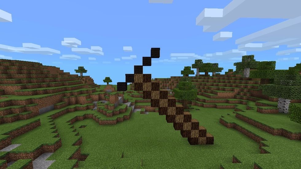 Make a diagonal line of 5 out of black wool...