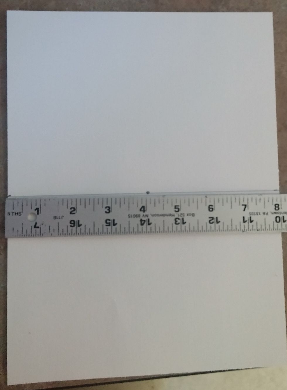 Make a dot on the horizon line at about 4 inches. This is the vanishing point.