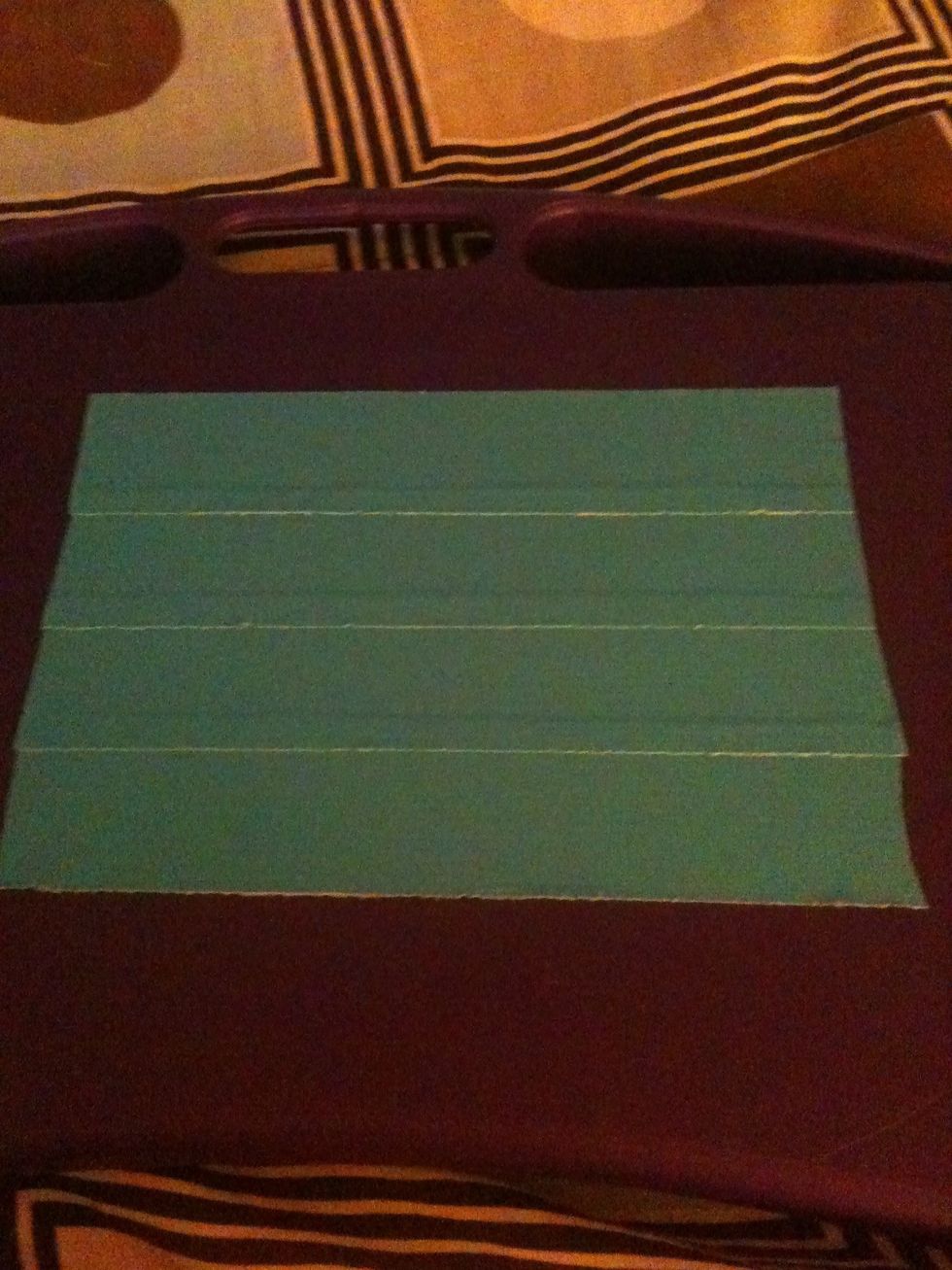 Make a duct tape sheet by overlapping the strips a little bit. Make it four strips tall.