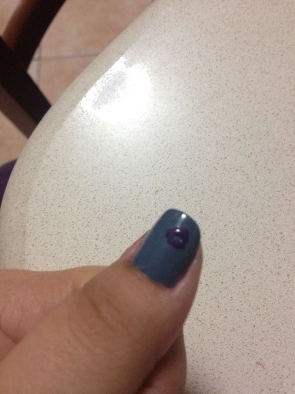 Make a few dots in a circle, creating a flower figure