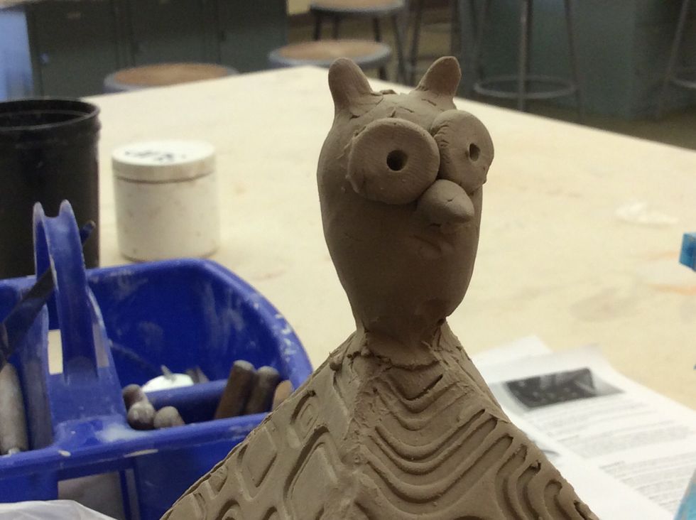 Make a finial for the lid which is constant with your design. Join securely by slip and scoring.