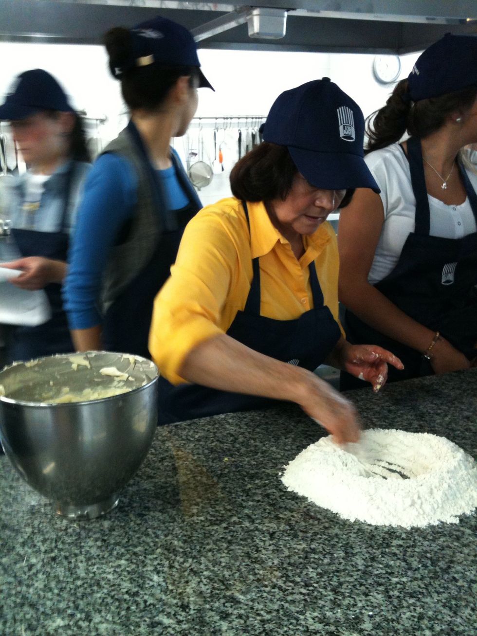 Make a flour crown and mix gently until ingredients are incorporated