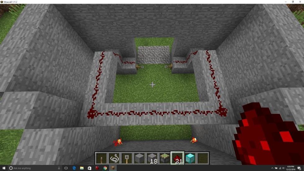 Make a four by seven square missing the side that is closest to the door. Place redstone on the blocks so that the two tripwires are connected.