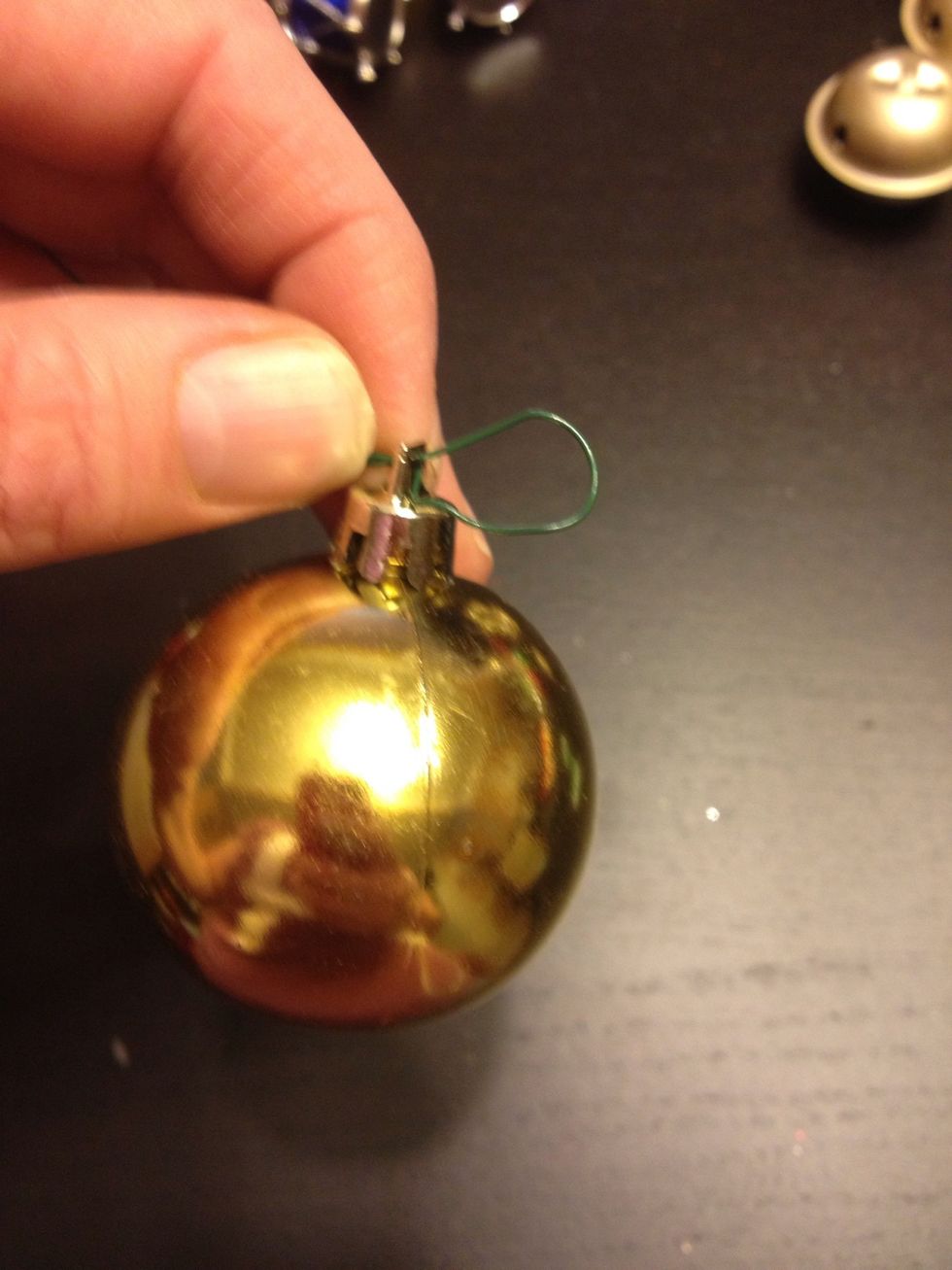Make a hanging hole on one end and then add the ornaments, I bought mine at the dollar store
