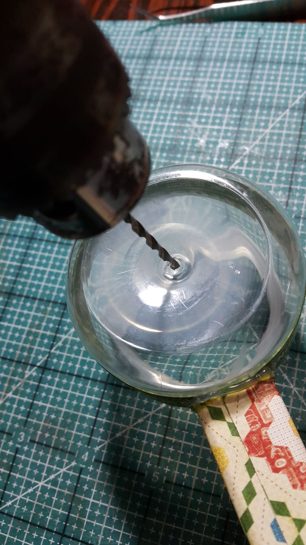 Make a hole at the back of the yogurt for putting through the black wire