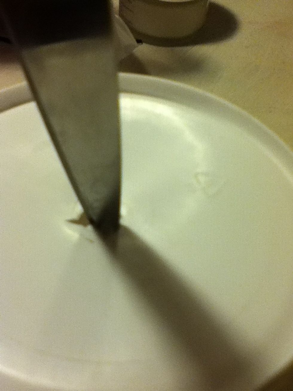 Make a hole in bottom of container. If your container is tapered make hole in narrower end