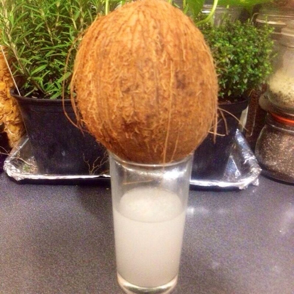 Make a hole on the top of coconut, drain coconut water and set aside.