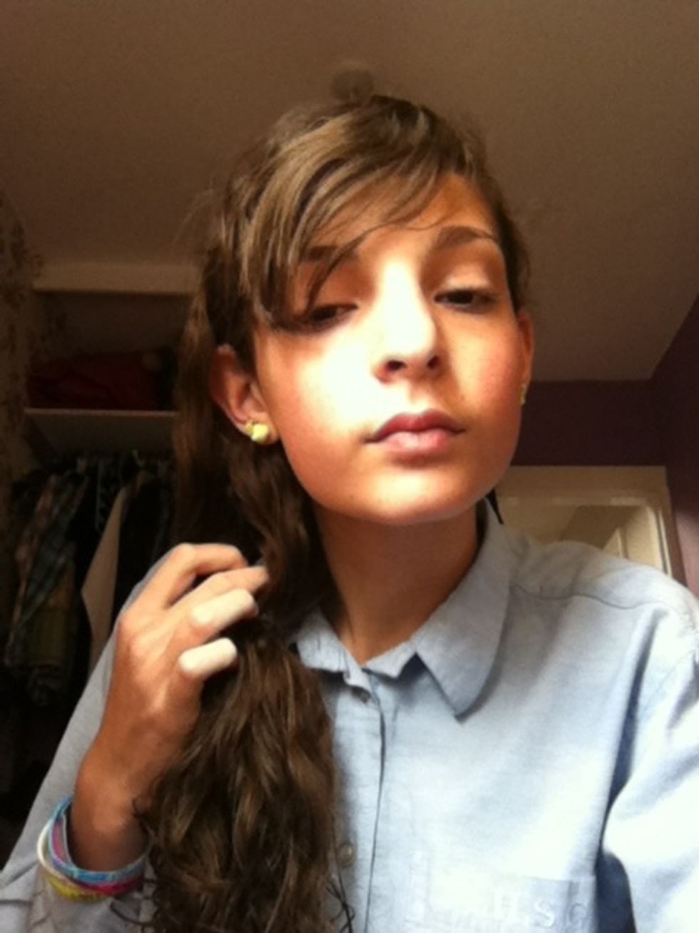 Make a hole through your hair above where the bobble is