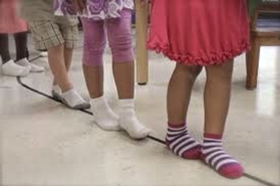 Make a line or circle on the floor with tape. Begin to walk on line with one foot in front of the other. Can sing or say:  "walking, walking on the line  / walking, walking heel to toe."