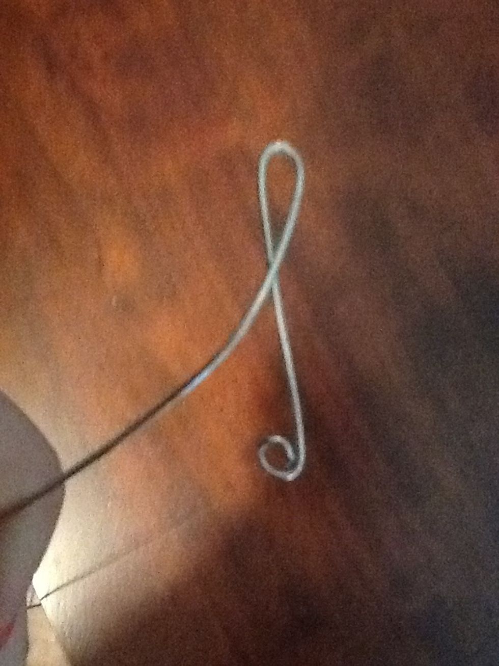Make a loop at the top so the rest of the wire goes to the left