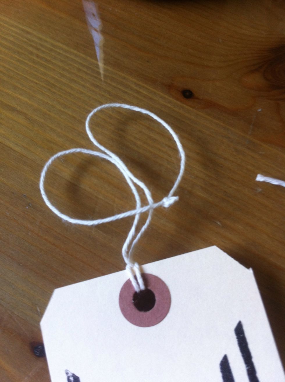 make a loop by folding the top of the loop down.