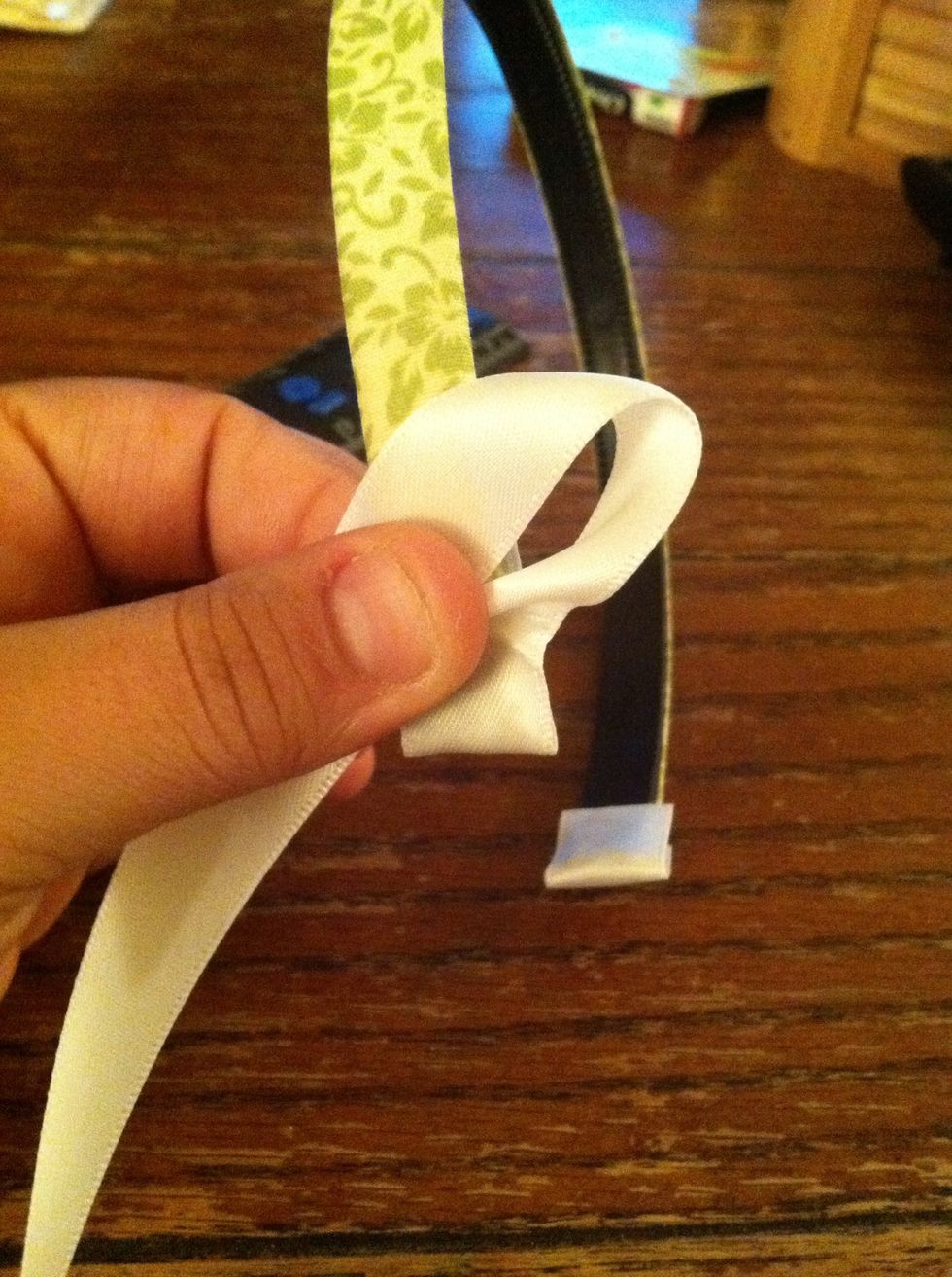 Make a loop. I tried to describe this step but I think the picture does a better job showing how its done. It can be on the right or the left, but make sure it's always consistent.