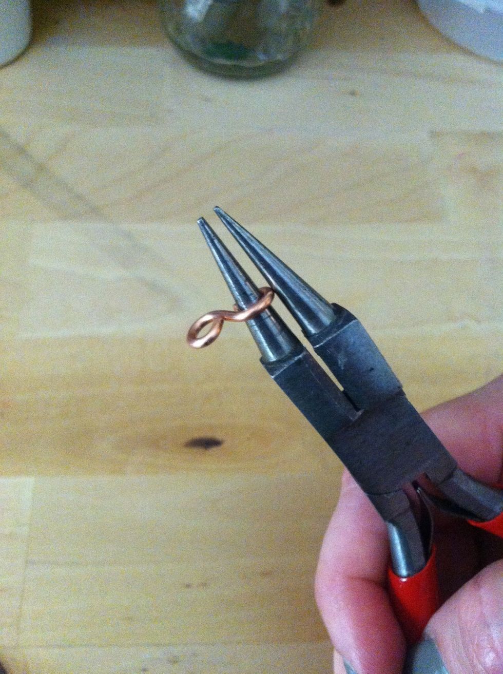 Make a loop on the opposite end of the wire. You will have a figure-8 shaped eye.