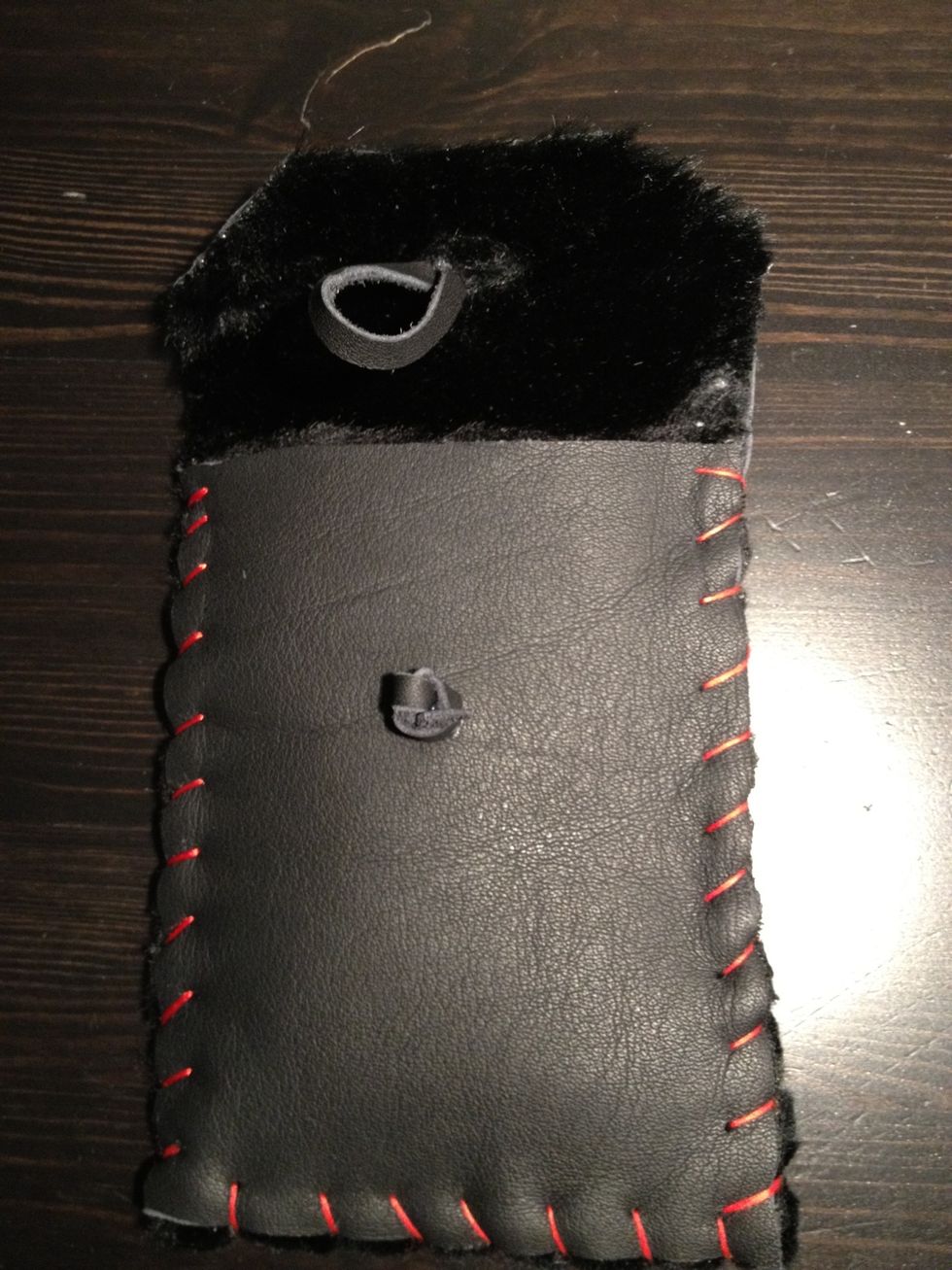 Make a loop using the remainder leather string and glue it carefully in place.