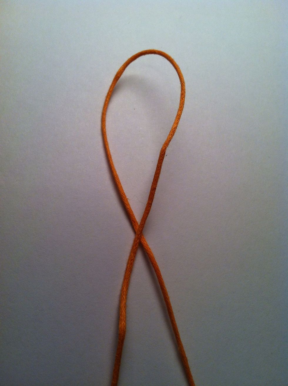 Make a loop with sliding end on top.