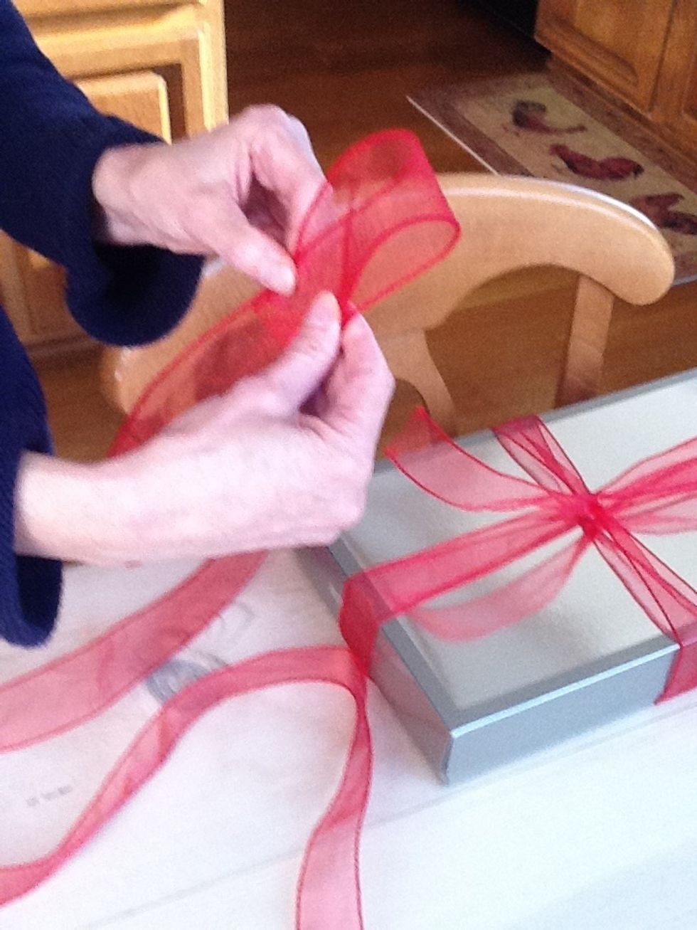 Make a loop with the ribbon about 2 inches