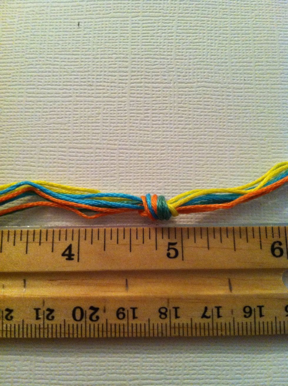 Make a loose overhand knot about 5 inches down. Refer to my guide on Knots if you aren't sure how to make an overhand knot. Tie it loosely.