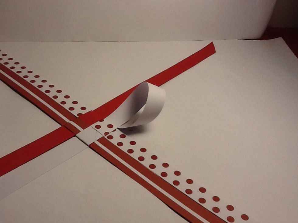 Make a loupe like so and fold it under the spotted