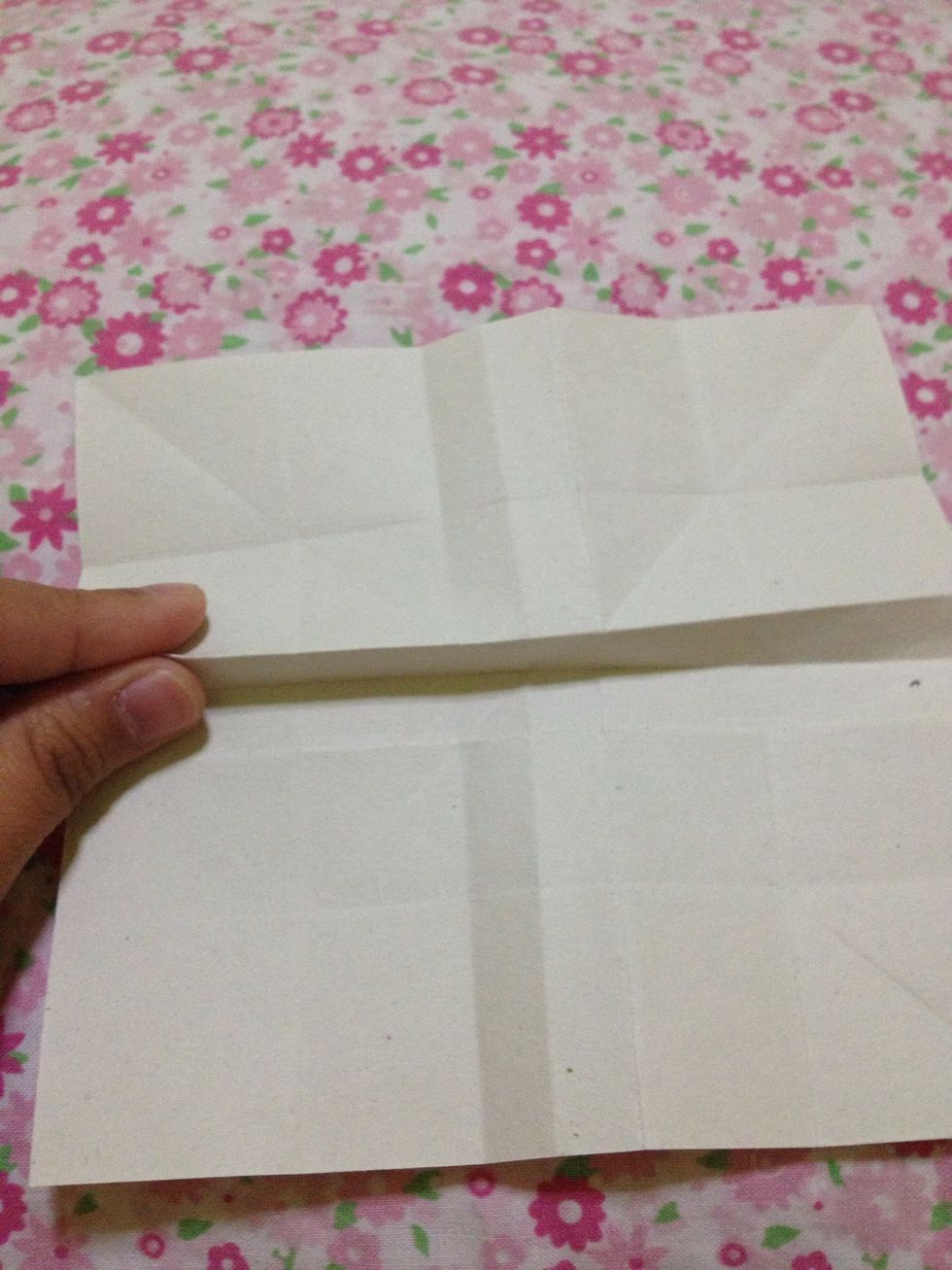 Make a mountain fold in the upper line of the center part.