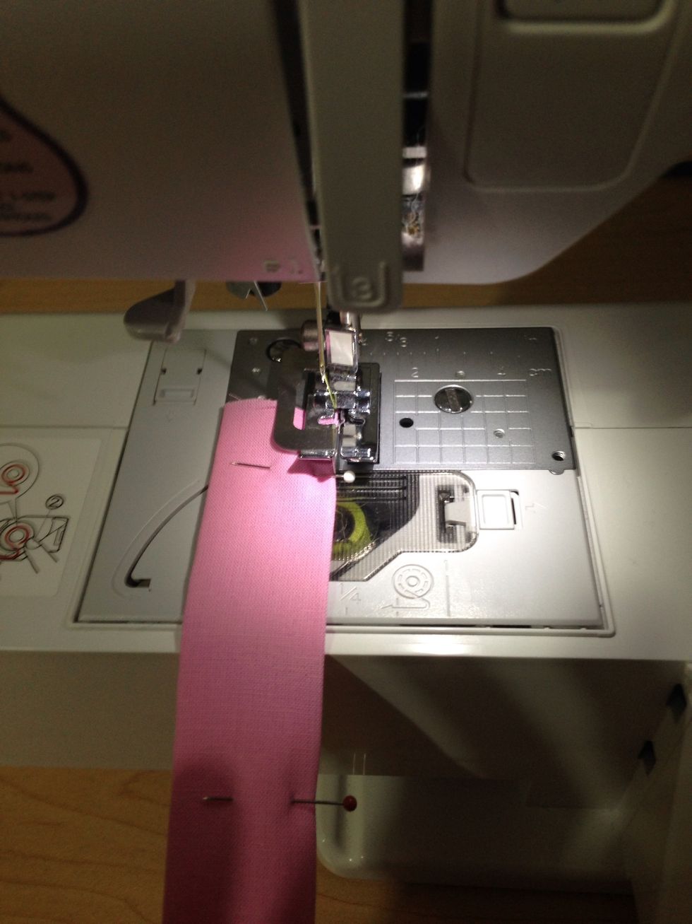 Make a narrow seam,backstitching at each end, on both sides of the strap. By doing a narrow hem on both sides it gives it a professional look.