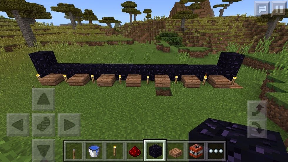 Make a obsidian line 14 blocks long. The picture cuts it off and the torches and slabs are for easy counting