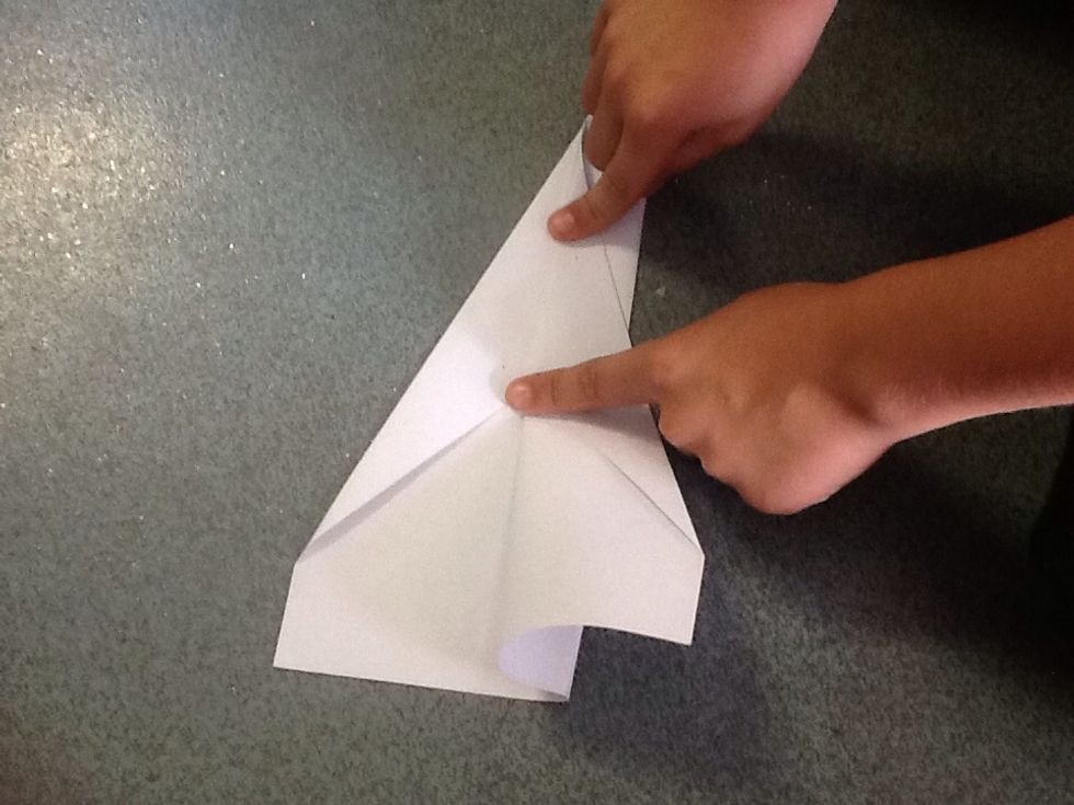 Make a parallel fold for the right wing about 3 cm from the seam.