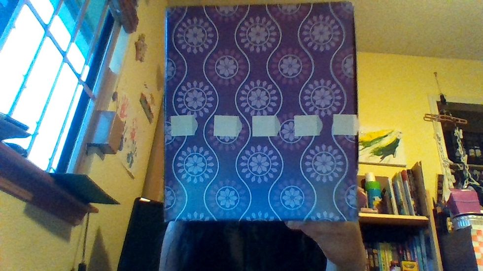 Make a path of sticky adhesive tabs where you want your ribbon to go around your tissue box- repeat on all sides