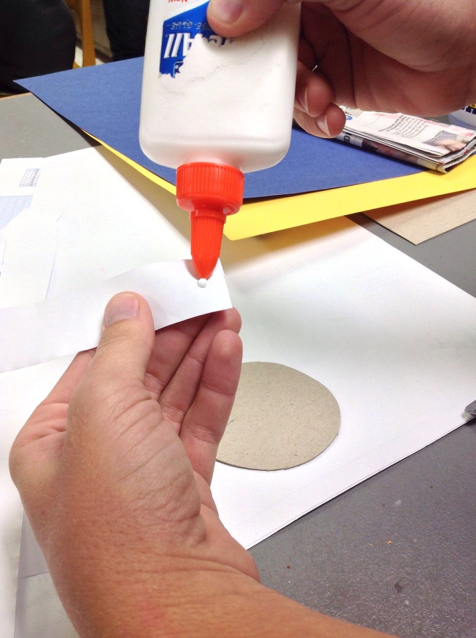 Make a petal by twisting and gluing a short strip of paper. JUST A DOT!