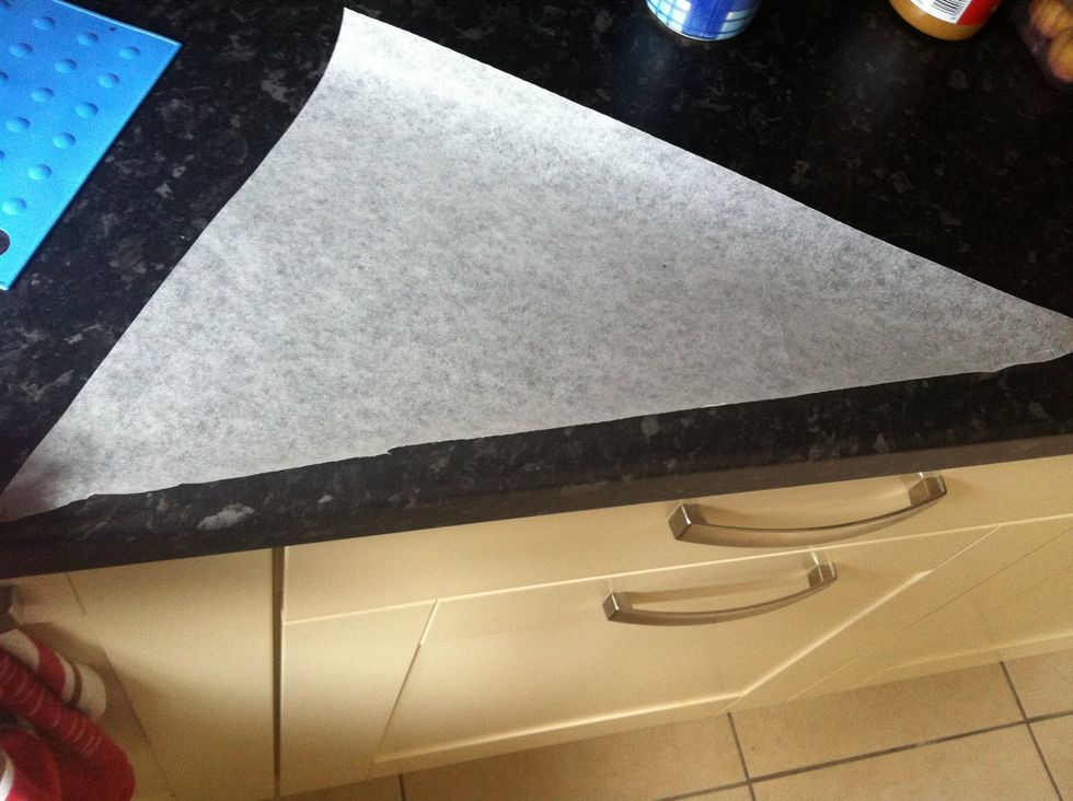 Make a piping bag with parchment paper...cut out a triangle like this