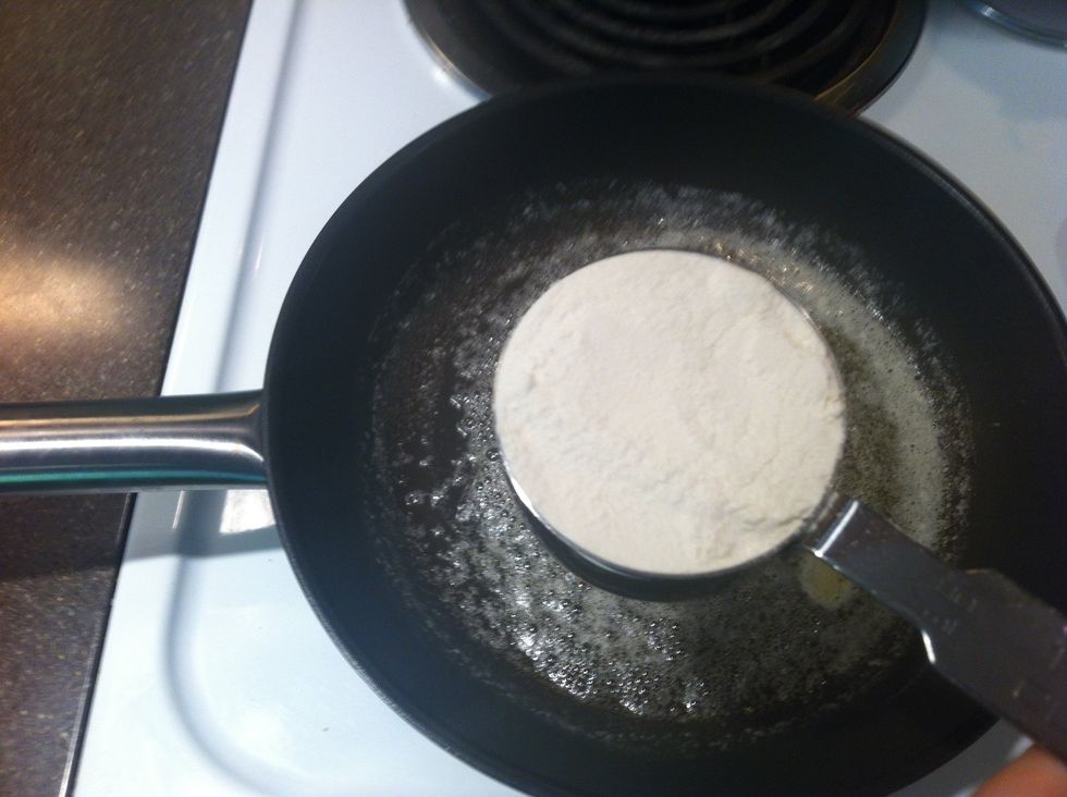 Make a roux. Add 1/3 cup flour to 1/2 stick of melted butter.