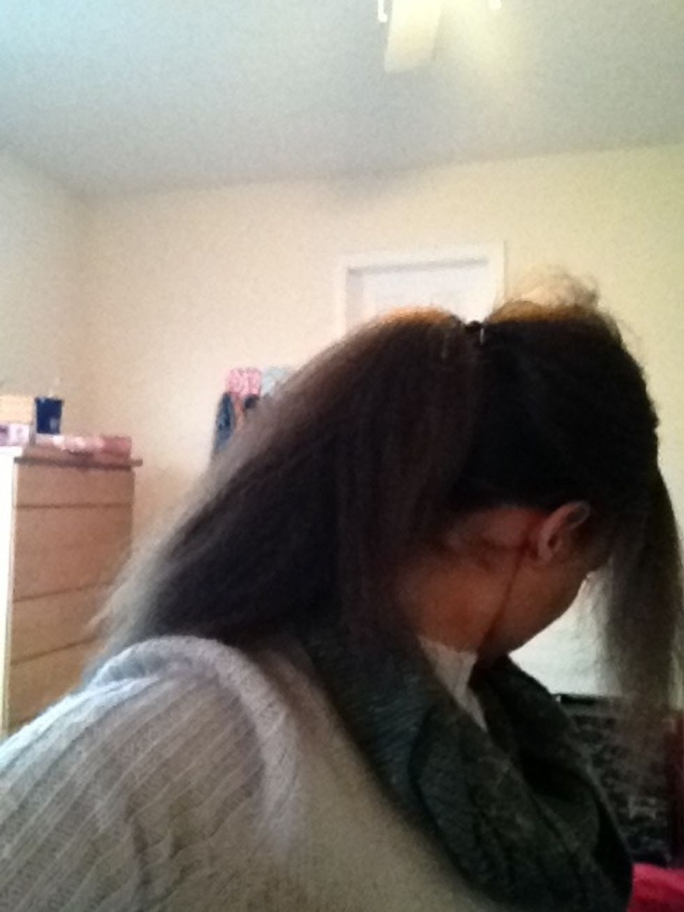 Make a second low ponytail above the first one, leaving your bangs free (Y'know, if you wanna leave them free)