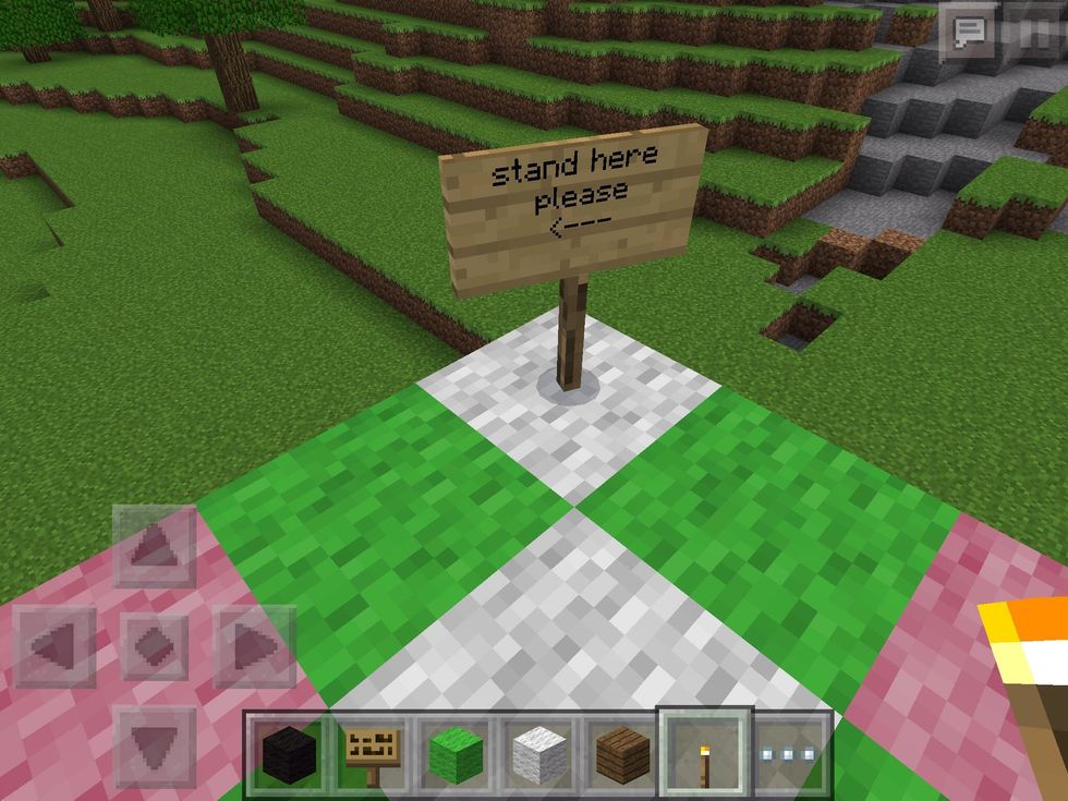 Make a sign that says "stand here please <---
