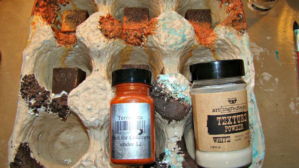 Make a similar paste with Terracotta, I did add more texture paste to this as I wanted it to be nice and chunky. Spray with water to cause medium to run and blend. Dry with heat gun.
