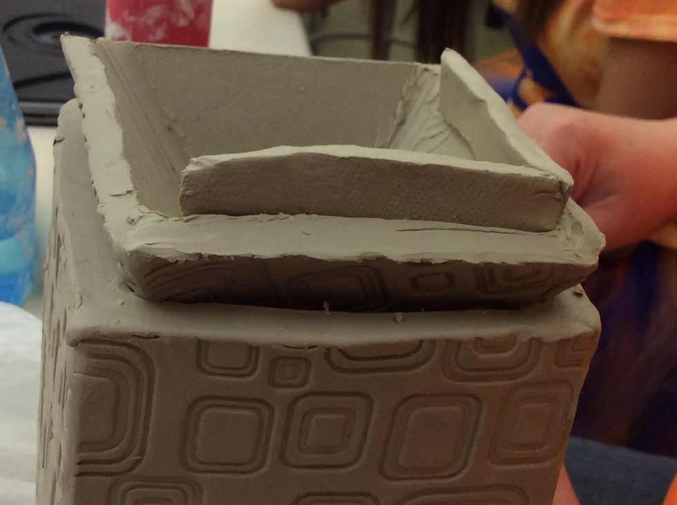 Make a slab flange to sit down inside the lantern and join to the lid.