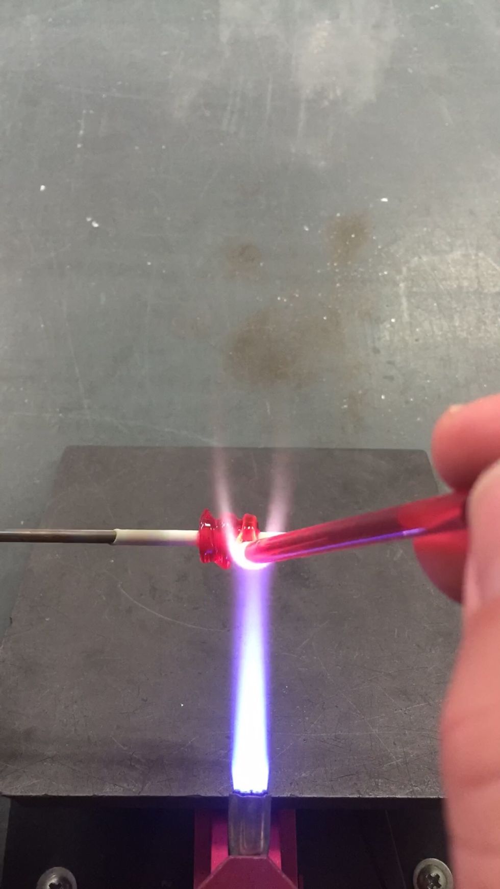 Make a small barrel shape, sized to fit in the ribbed cylinder Beadroller.  This is the core, and more glass will be added, so use one of the smaller slots in the Beadroller.