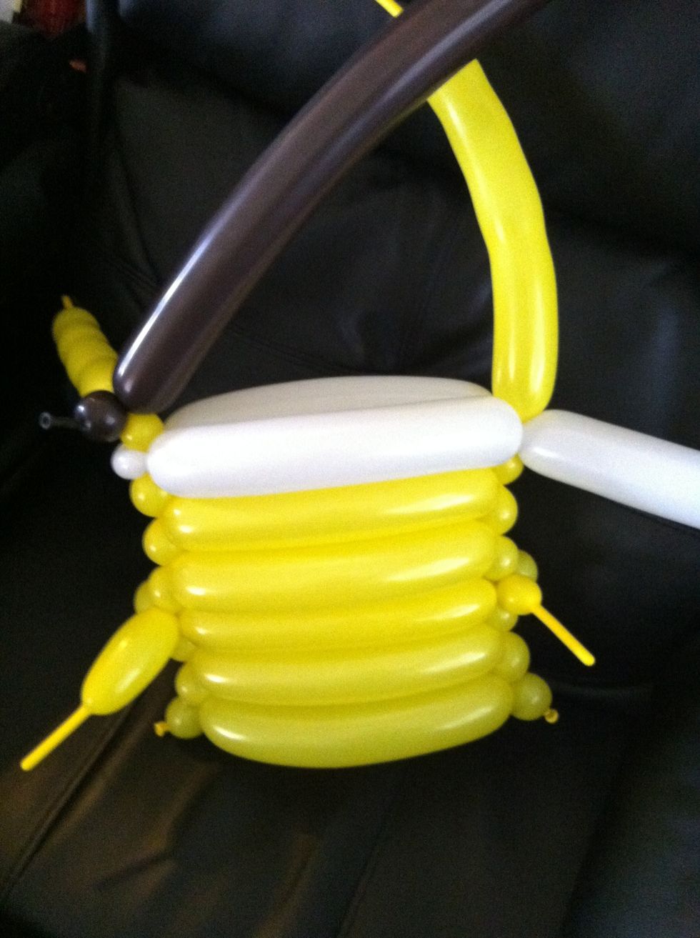 Make a small bubble with the yellow to go up a level and attach the brown balloon with a small bubble