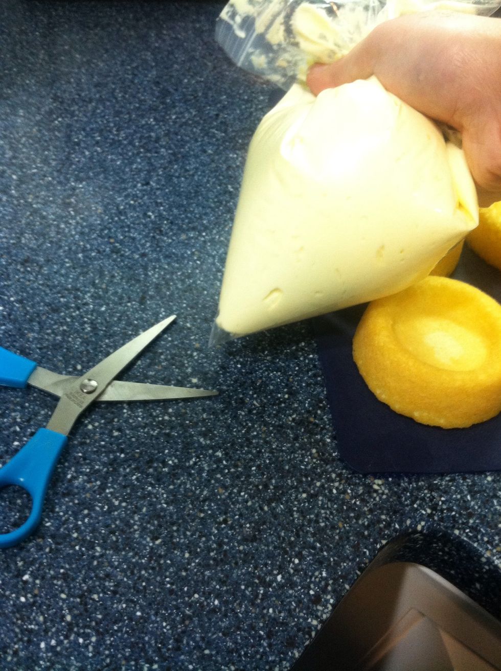 Make a small cut at one corner of the bag to pipe out the cream.