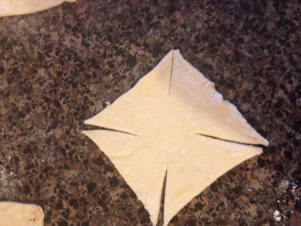 Make a small cut on each corner, leaving the center intact.