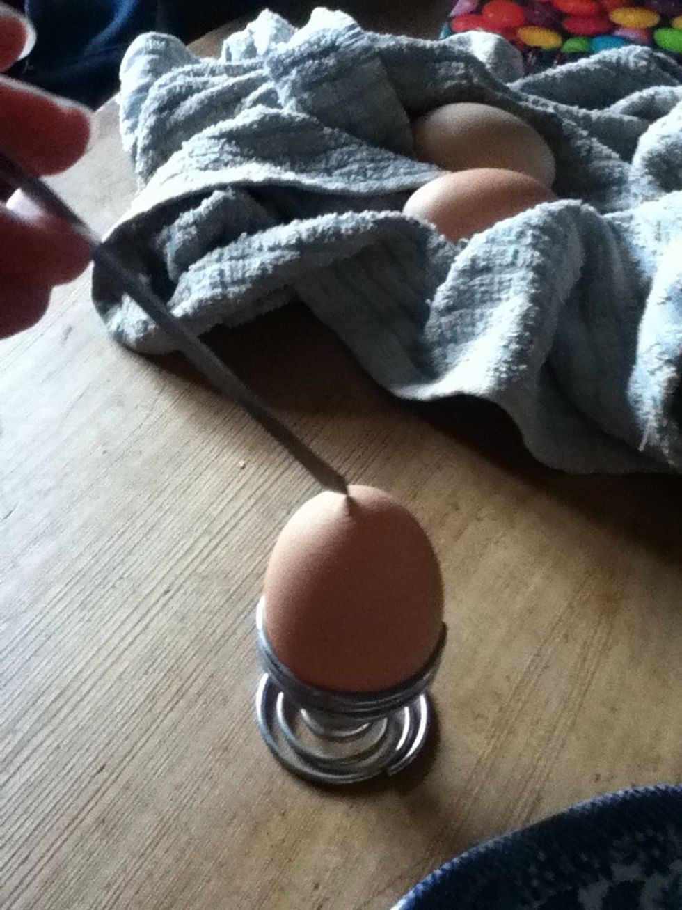 Make a small hole in top of egg, be careful as they are delicate