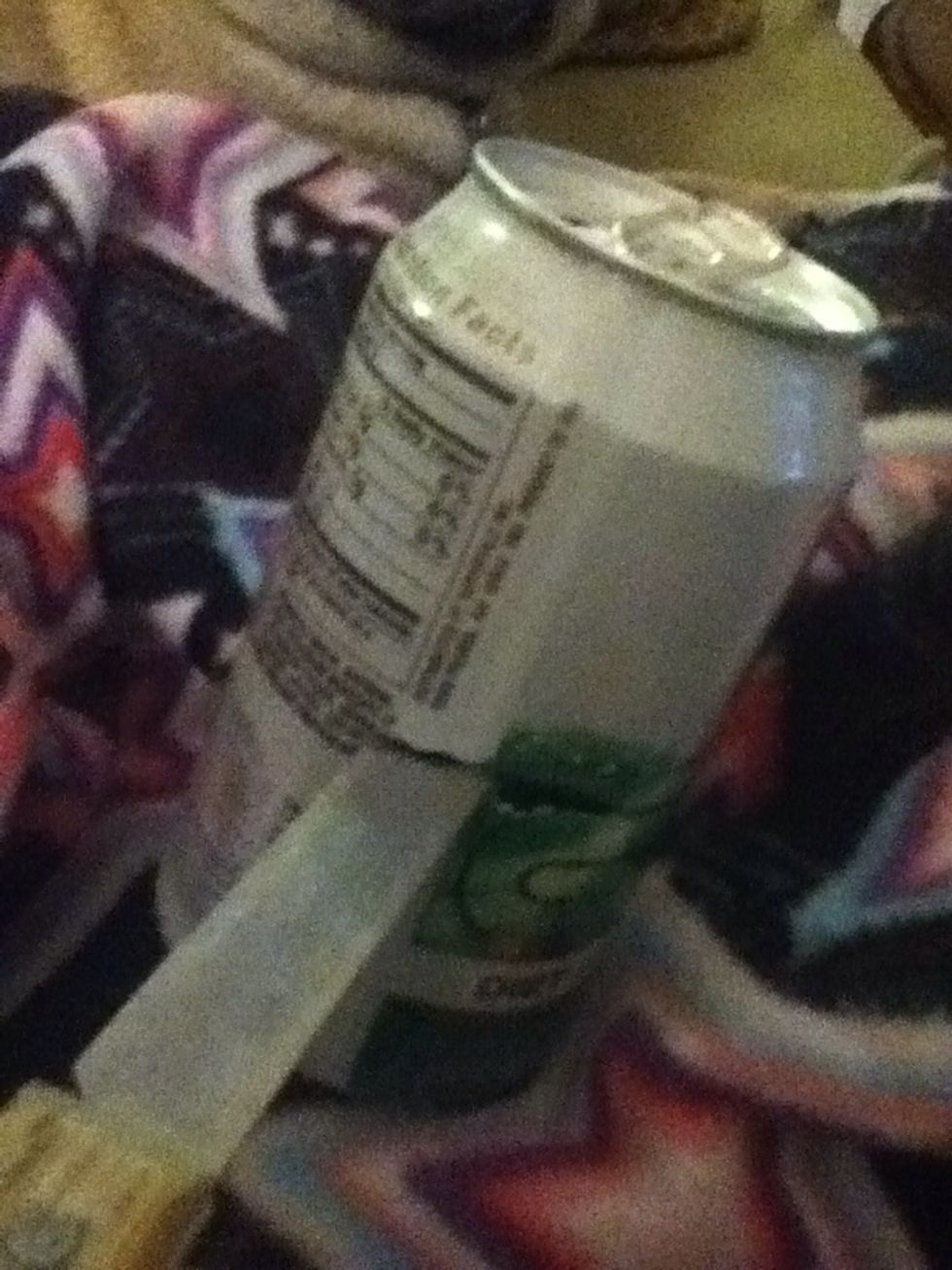 Make a small in a incision  in the soda can with your knife.