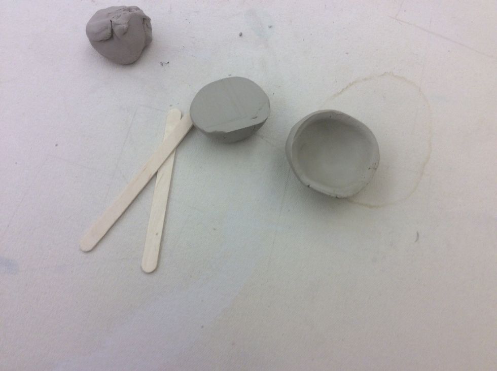 Make a small pinch pot from both halves.
