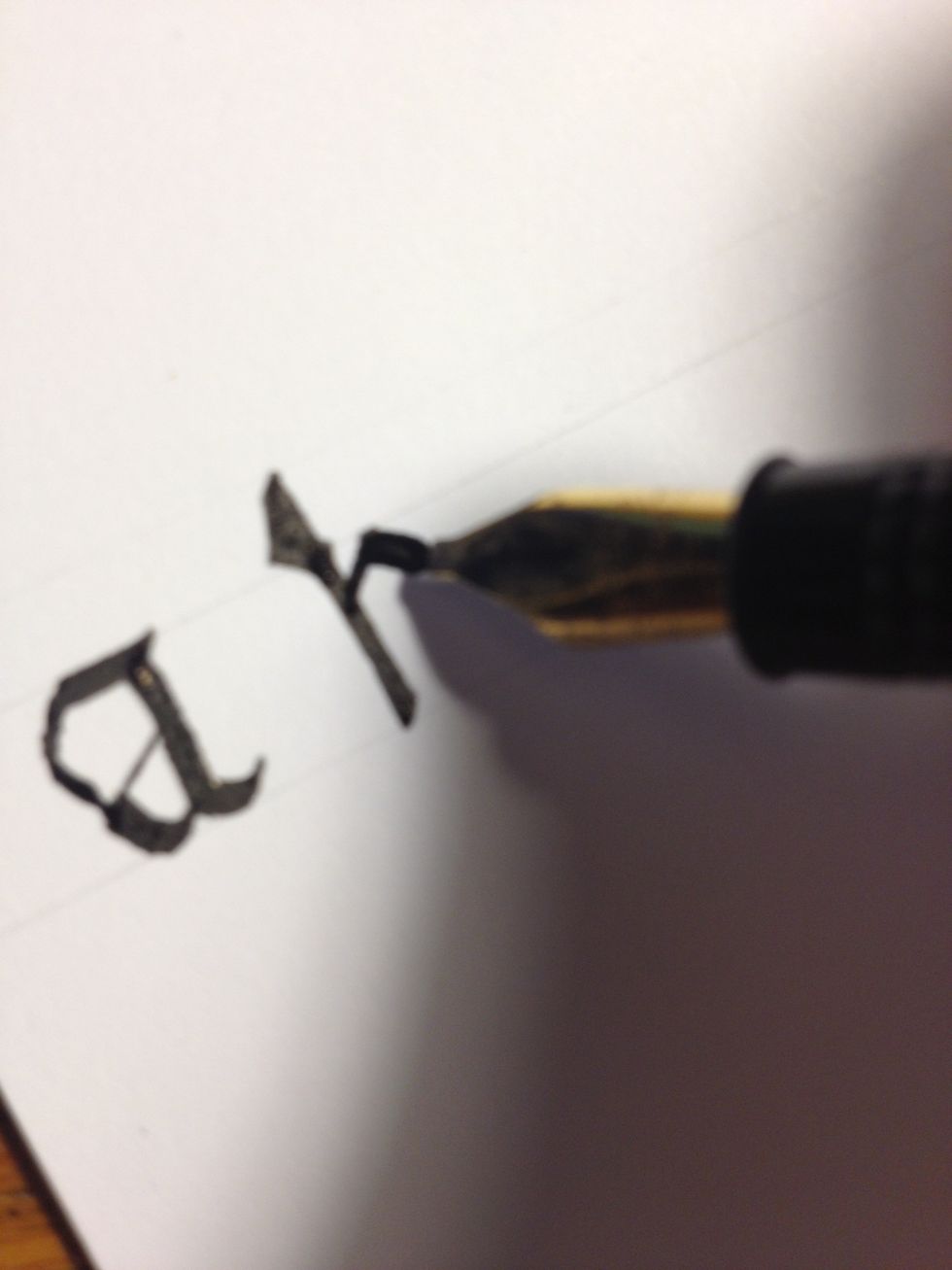 Make a thin diagonal line about halfway up the trunk, but below the top line. Make it continue to the top line, then make a thick downward curve.