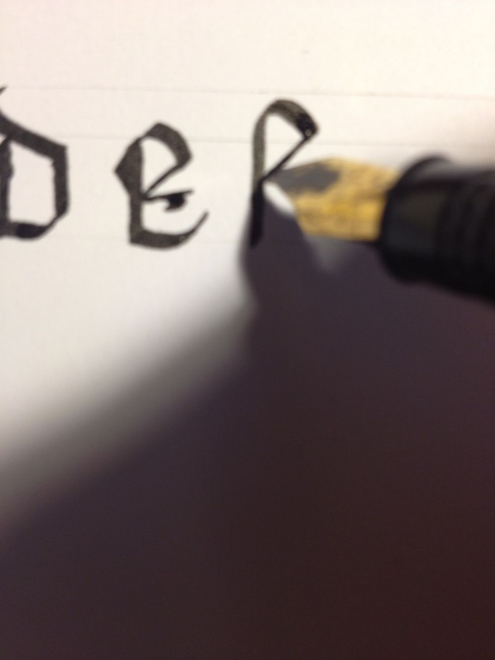 Make a thin downward diagonal from the end of the curve down to the trunk.