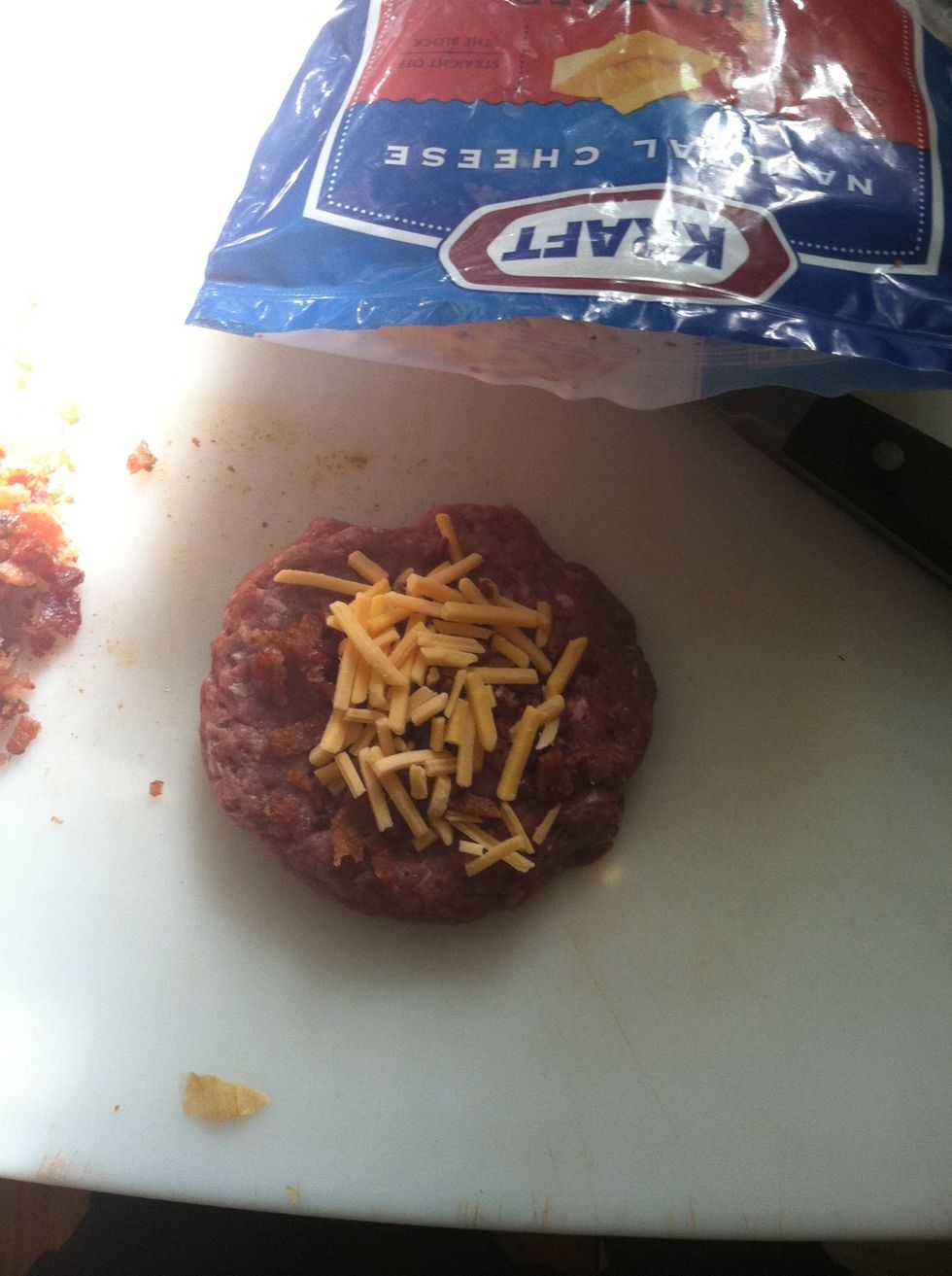 Make a thin patty, drizzle with bacon and cheese