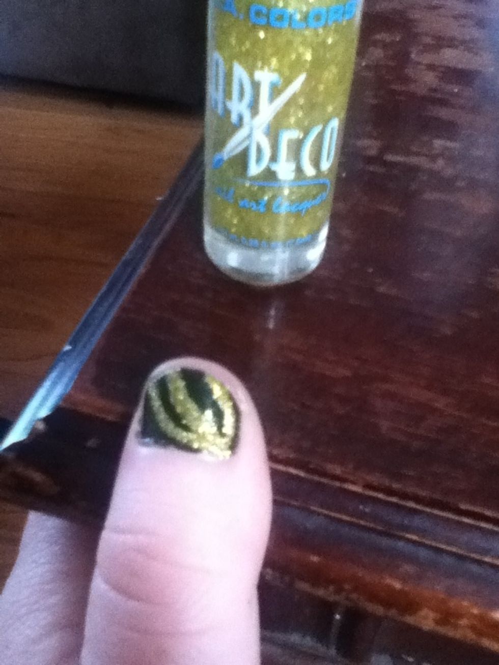 make a third curved line on your nail. make all the ends of the line point the same direction.