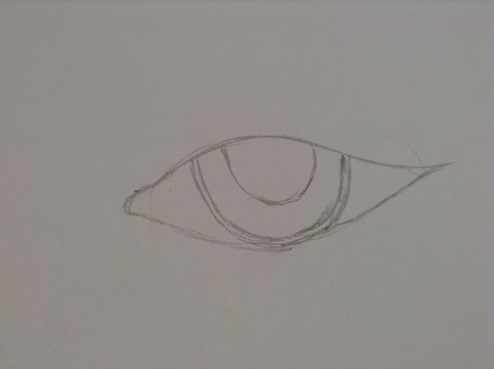 Make a third smaller "U" inside the eye for the pupil.