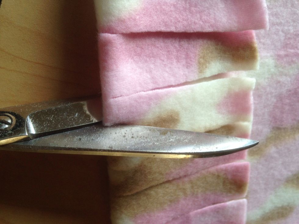 Make a tiny slit on the fold....