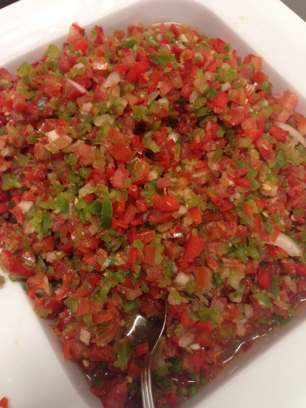 Make a tomatoe, red, green, and yellow bell pepper pico de gallo